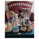 Porcelain dolls, baby with wood cradle