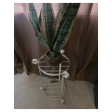 Metal plant stand with plant