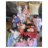 Dolls and tote full of doll clothes