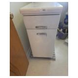 Metal cabinet 34 in tall by 15 in wide