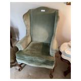 Green color upholstered wingback chair