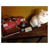 table, ceramic cat, misc tools