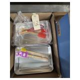 box of cake pans and utensils