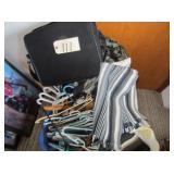 Laundry basket with hangers, rugs, misc