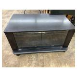 Tv stand with glass doors on wheels, 1 shelf, 23"