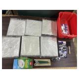 Plastic drop clothes, paint brushes, trash bags