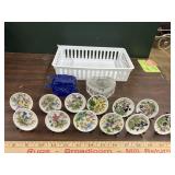 12 tiny flowered plates with stands, blue glass
