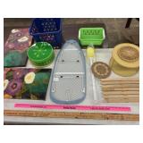 Baskets, yardsticks, ironing board, all items in
