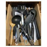 Contents of drawer, kitchen items bring boxes