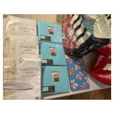 Lot of pillows, photo albums and iron board covers