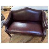 Maroon vinyl love seat,24 x 50 x 34 tall,