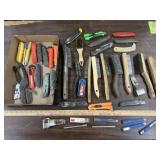 Box of wire brushes and utility knives