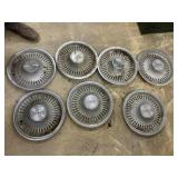7 Oldsmobile hubcaps