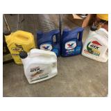 10 jugs of coolant, oil & tranny fluid, various