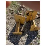 Pair weight brackets for John Deere skid loader