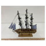blue & white sails on wooden ship, approx 14 x 15