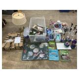 Chandellier, lamp, pump bottles, garden books,