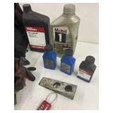Tote of chainsaw oil & tools