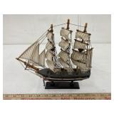 Small black wooden Ship, approx. 10 x 9 1/2 x 2