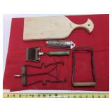 4 kitchen tools and wooden cutting board