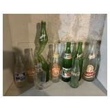 9 bottles, includes Coca-Cola, Sprite, Hires,