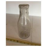 1 qt E.C.M.A bottle w/original cap covered  with