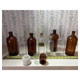 11 bottles includes Lysol, clorox & medicine