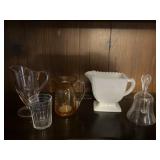 Lot of colored glassware & dinner bell