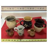 6 pottery/ceramic jugs 1 marked R.R.P Co USA
