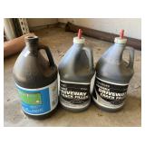 3 jugs of driveway crack filler, full