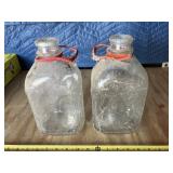 (2) 1/2 gallon milk bottles
