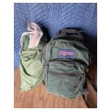 Backpack with frisbees and possibly a tent