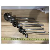 7 ladleswith ounce measurement on them includes