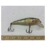 vintage wooden fishing lure closely resembles a