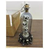 3 skulls in bottle lights & plays music whenopened