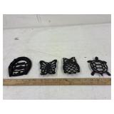 4 different cast iron trivets