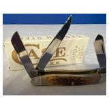 Case XX Amber Bone Peach Seed Jig Medium Stockman