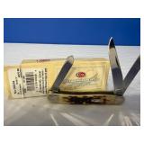 Case XX Amber Bone Peach Seed Jig Medium Stockman