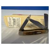 Case XX Amber Bone Peach Seed Jig Medium Stockman