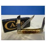 Case XX Amber Bone Peach Seed Jig Medium Stockman