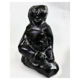 BLACK SOAPSTONE CARVING OF A SEATED WOMAN