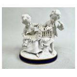 BISQUE GROUP OF CHILDREN WITH A BIRD IN A CAGE