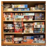 LOT OF JIGSAW PUZZLES - UPPER CABINET