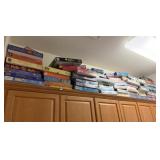 LOT OF JIGSAW PUZZLES- TOP OF CABINET