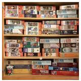 LOT OF JIGSAW PUZZLES - UPPER CABINET