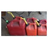 (6) Red Plastic Gas Cans - 5 Gal about 1/2 Full-