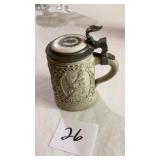 A  antique German beer stein, likely made of