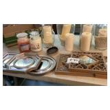 Four vases with candles, two 2 Yankee candles,