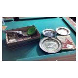 Silver plates, coal shovel, clothing construction