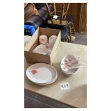 Plastic soup bowls with spoons, plates